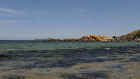 The clean waters of the Black Sea with some rocks and an island in the background.の写真素材