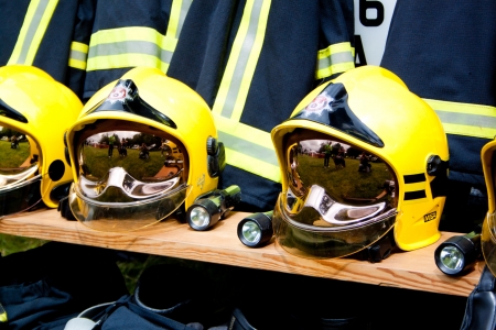 fire and rescue service helmets on a benchのeditorial素材