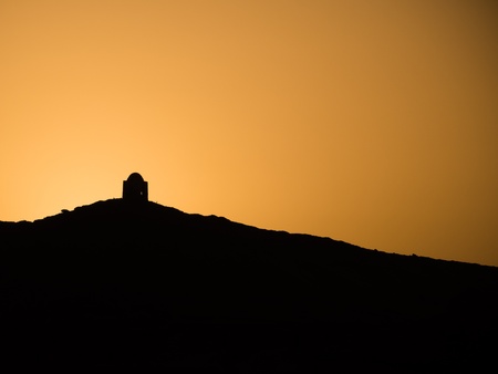 sillhouette of a Mountain and tomb at sunset on the Nileの写真素材
