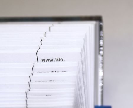 Fanned pages - The cutting face of a phone directory with fanned pages.の写真素材