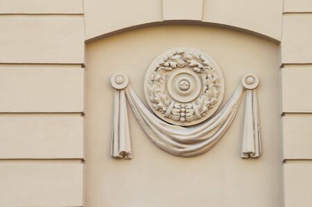 Moulded Decorative Panel - A close-up detail of a building facade decor. A moulded plastic panel. Early soviet-epoch style.の写真素材