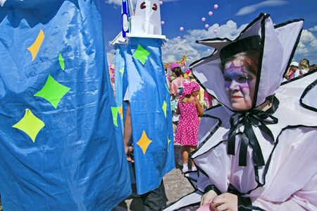 ST PETERSBURG - JUNE 28: People playing clowns at outdoor carnival Life in Pink Festival June 28, 2008 in St Petersburg, Russia.のeditorial素材
