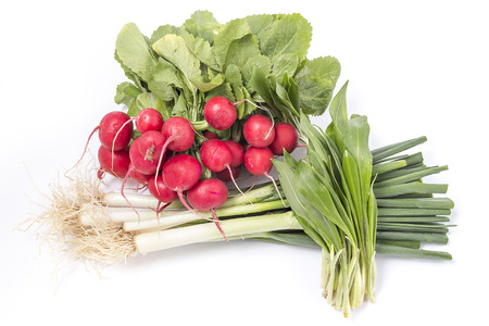 Bunch of small garden radishes green onion and wild garlic isolated on a white backgroundの写真素材
