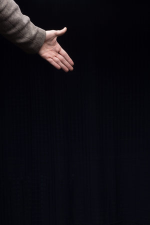 man hand on black backgroundの写真素材