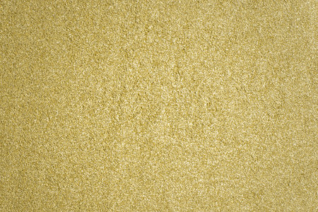 Detailed texture of glittering golden dust surface. Golden Shiny Wallpaper , Perfect for Christmas, New Year or any other Holidays Background. Golden fine powder.の写真素材