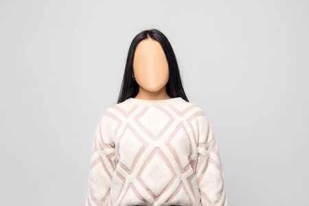 Woman Without a Face. On the walls hang the face masks. Nobody.の写真素材