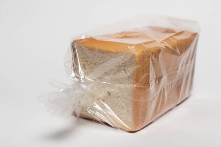sliced bread isolated on white background. White square fresh yukon bread on a white backgroundの写真素材