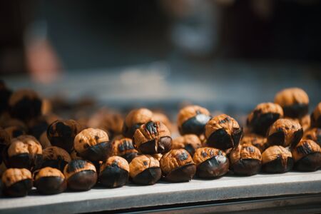 Closeup of street food of roasted chestnuts. Traditional authentic street food.の写真素材