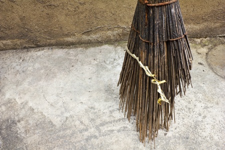 old broom on the wallの写真素材