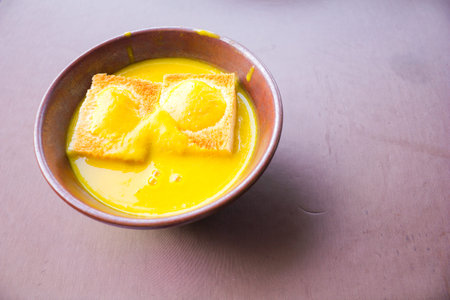 Bowl of pumpkin soup with bread