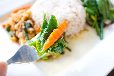 Rice with vegetables on plateの写真素材