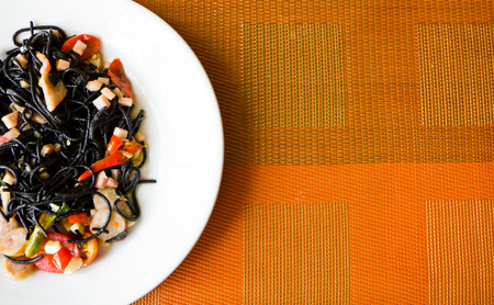 spicy black spaghetti on plateの写真素材