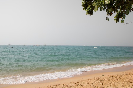 overcast sky on a sandy beach and seaの写真素材