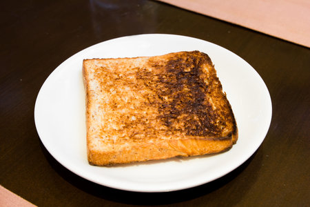 sandwich bread over burn on dish
