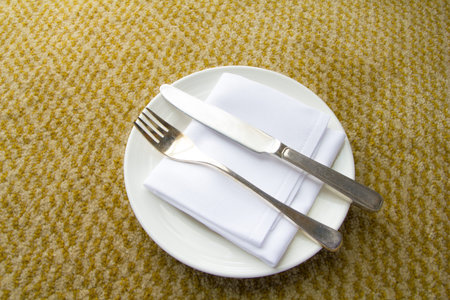 white plate, knife, fork with empty