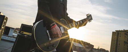 Guitarist playing outdoorsの写真素材