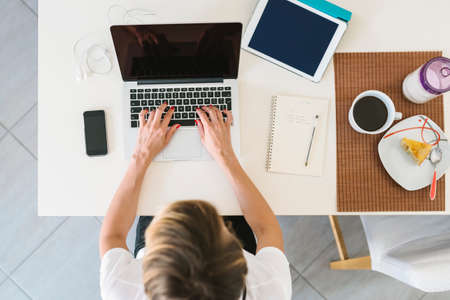 Businesswoman working from home view from the topの写真素材