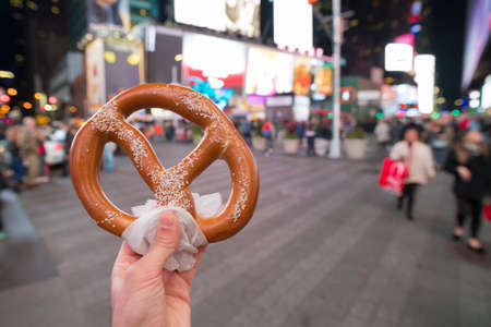 Eating Pretzel fast food in New York Cityの写真素材