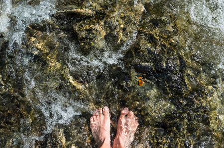 Refresh feet in mountain streamの写真素材