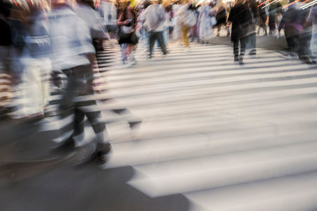 Crowd Walking Across Crosswalk with Motion Blurの写真素材