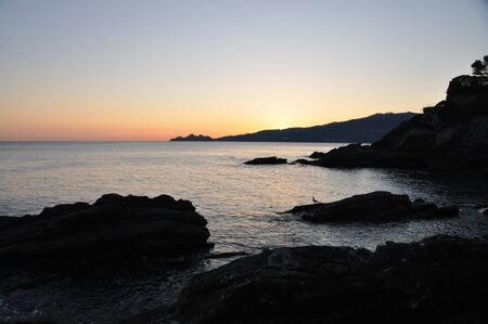 Sunset in Zoagli promenade with Tigullio gulf and Portofino in the background, Liguria, Italyの写真素材