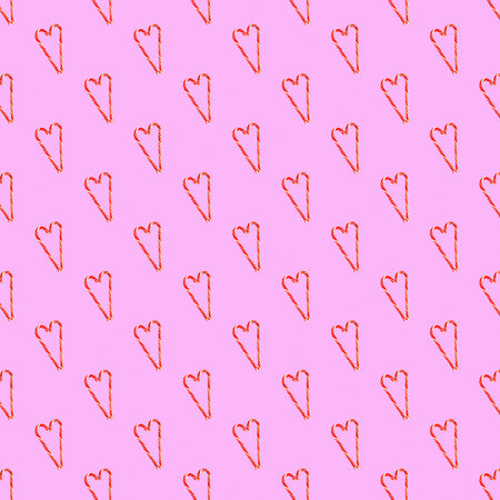 Red striped candy canes of Santa are stacked in the shape of a heart seamless pattern, ornament....