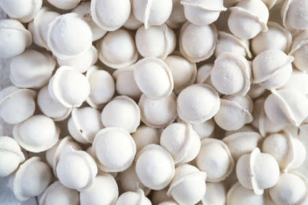 Frozen dumplings-pattern, background, texture. Molded dumplings close-upの写真素材