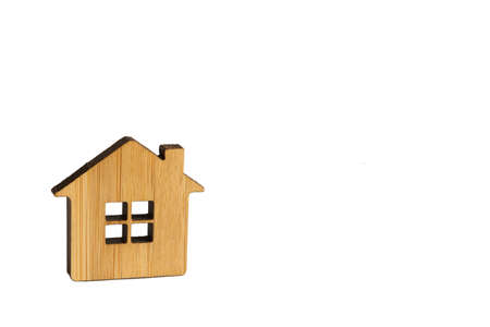 Wooden house on a white background isolated. Farm, new home, construction, relocation, real estate purchase, mortgage, rent. Keychain, pendant, modelの写真素材