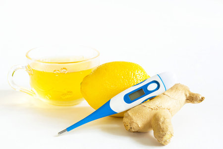 Medicinal tea in cup, ginger, lemon-strengthen immune system in the cold season. Vitamin drink for...