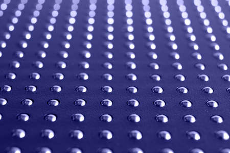 A metal ball in its cell is an abstract background. The concept of society - everything in its place, stand out from the crowd, one of many. Texture, patternの写真素材