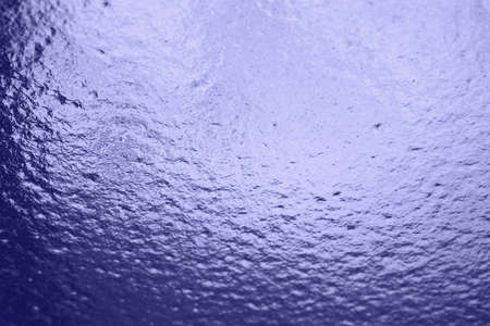 Frozen water on the window. Transparent glass with ice is translucent, freezing rain. Car windshield after rain - road safety in winter, no visibility. Backgroundの写真素材