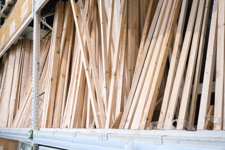 Wooden boards and bars in the warehouse of the building materials store for repair, decoration and construction of the houseの写真素材