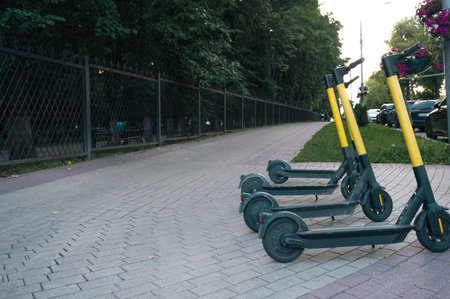 City transport electric scooter - eco-friendly means of transportation, rent on the city streetの写真素材