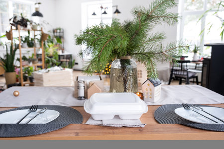 Food delivery service containers on table in white kitchen, festively served for celebration of...