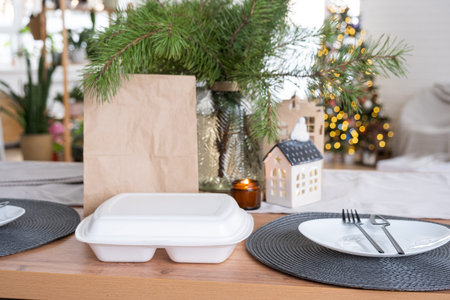 Food delivery service containers on table in white kitchen, festively served for celebration of...