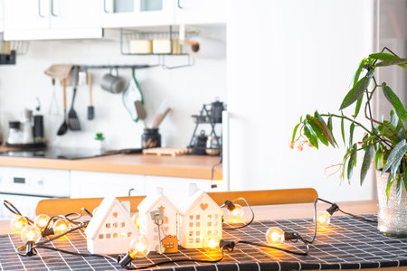 Key to house of cozy home on table of kitchen. Building, design, project, moving to new house, mortgage, insurance, rent and purchase real estateの写真素材