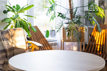 Empty round table for installation and demonstration of product in interior with Tropical indoor...