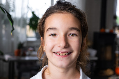 Portrait of a child with a confident smile, orthodontic plate use for pediatric health and teeth...