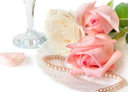 A romantic dinner with beautiful roses on a whiteの写真素材