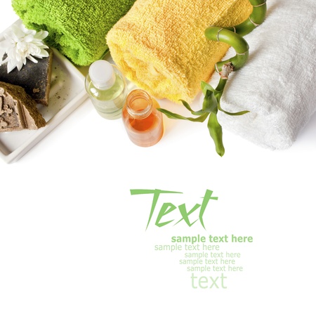 Spa background with towels, shampo, bamboo and soap isolated on a whiteの写真素材