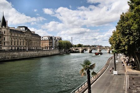 A view of the Conciergerie in Paris across the river Seineの写真素材