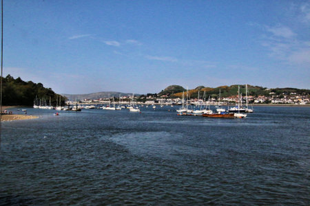 Boats and yachts moored in the harbour of Conwy in North Walesの写真素材