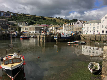 A view of the Harbour at Mevagissey in Cornwall showing the sailing boatsのeditorial素材