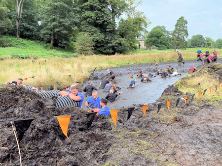 Cholmondeley in Cheshire in the UK in September 2021. People taking part in a Tough Mudder event in...