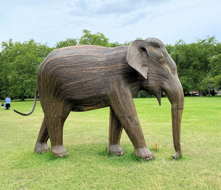 London in the UK in July 2021. A view of some wooden Elephants in a London Park