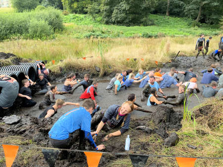 Cholmondeley in Cheshire in the UK in September 2021. People taking part in a Tough Mudder event in Cheshireのeditorial素材