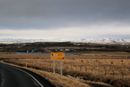 Icelandic landscape with snow covered mountains and clouds in winter.の写真素材