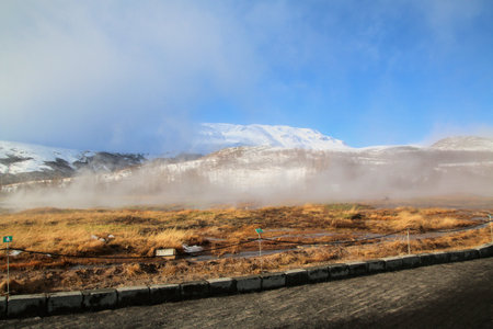 Icelandic landscape with snow covered mountains and clouds in winter.の写真素材