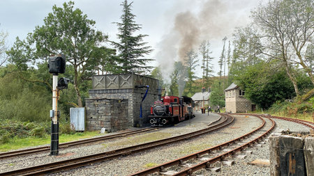 Train on a narrow gauge railroad track in North Wales near Snowdoniaのeditorial素材