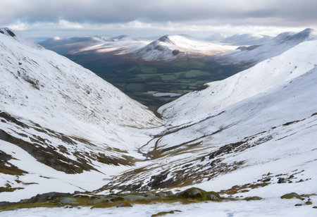 Beautiful Winter landscape image of Snowdonia National Park in Walesの素材